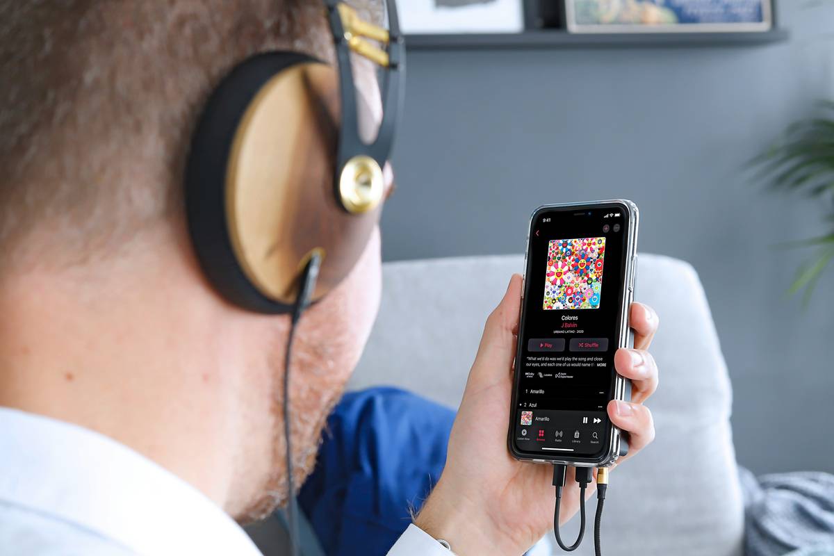 pj media phone podcast setup showing smartphone with external mic in quiet room